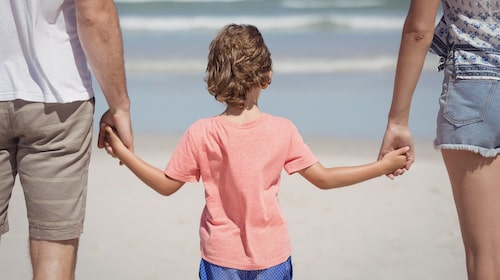 Kid holding parent's hand